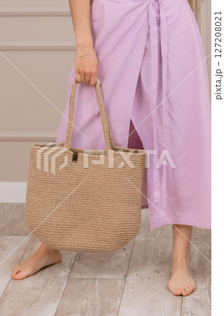Summer outfit with straw hat and jute bag, perfect for vacation, beach or boho fashion shoots. 127208021