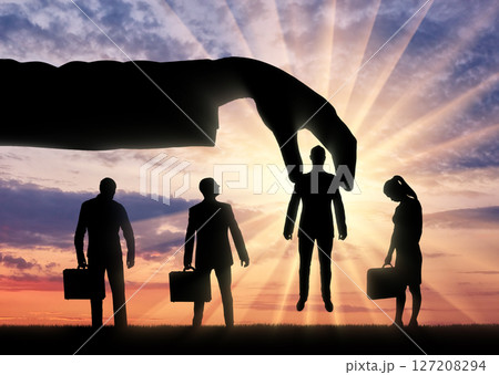 Silhouette of a group of people, candidates for the post. Hand boss chose one man 127208294