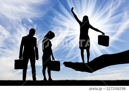 Silhouette of a hand holds a jubilant woman, a frustrated man and woman are standing nearby 127208296