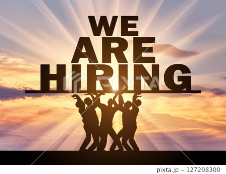 Concept of hiring. Silhouette of a group of people hold text ad, we are hiring 127208300