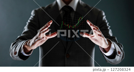businessman with financial symbols coming from hand, stock markets concept. businessman with financial symbols coming from hand, stock markets concept. 127208324