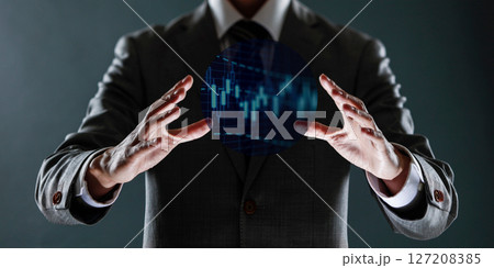 businessman with financial symbols coming from hand, stock markets concept. 127208385