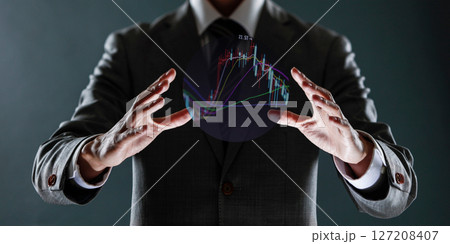 businessman with financial symbols coming from hand, stock markets concept. businessman with financial symbols coming from hand, stock markets concept. 127208407