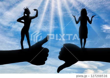 Selfishness and ego. Selfish woman with a crown who thinks she is better than another woman. Selfishness and ego. Selfish woman with a crown who thinks she is better than another woman. 127208516