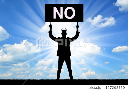 Selfishness. Selfish male businessman or boss with a crown, holding a poster with the word no. Selfishness. Selfish male businessman or boss with a crown, holding a poster with the word no. 127208530