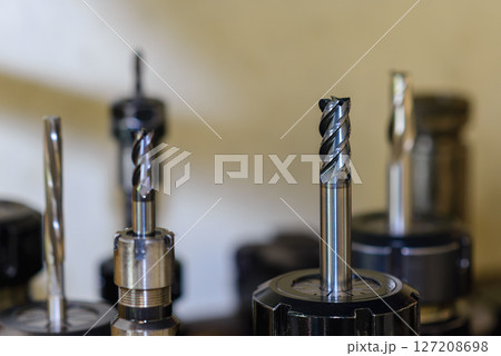 Close-up scene the used flat nose or square solid end mill tools. 127208698