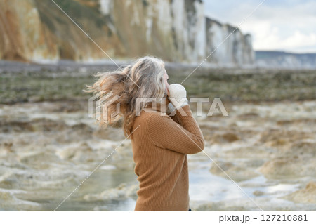 Portrait of a sixty-year-old woman with a gray hair 127210881