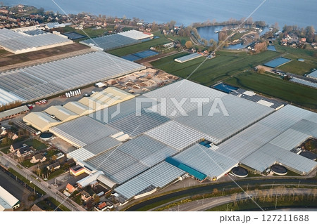 Greenhouse farming from above throug an aircraft window 127211688