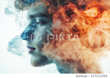 Close-up of a young man's face surrounded by clouds of light smoke, white background. 127212264
