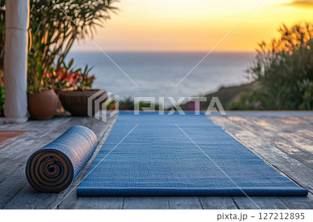 Yoga Mat at Sunset on a Deck Overlooking Ocean Yoga Mat at Sunset on a Deck Overlooking Ocean 127212895
