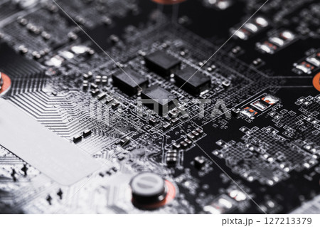 Detailed view of a circuit board featuring intricate pathways and components Detailed view of a circuit board featuring intricate pathways and components 127213379