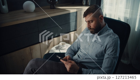 Stock Exchange Trader Monitoring Real-Time Stocks Using Smartphone, Making Trading Deal 127213465