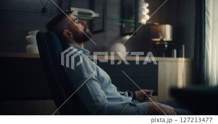 Stock Exchange Broker Sitting in Chair with Eyes Closed, Relaxing After Work and Successful Trading Day 127213477