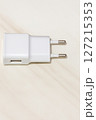 White USB Wall Charger Adapter on Ceramic Background Top View White USB Wall Charger Adapter on Ceramic Background Top View 127215353