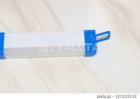 Long Rechargeable LED Flashlight with Blue Handle Isolated on White Background 127215513