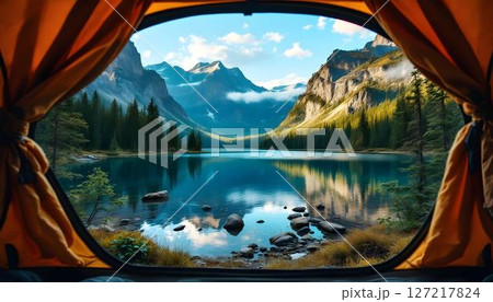 A camping tent provides a scenic glimpse of a lake and mountains, highlighting the tranquility of the great outdoors A camping tent provides a scenic glimpse of a lake and mountains, highlighting the tranquility of the great outdoors 127217824
