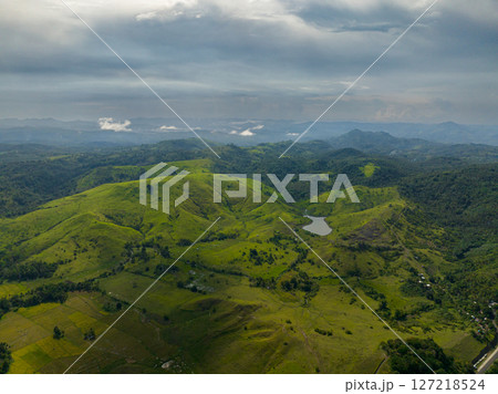 Mountain landscape with rainforest and agricultural land. Mindanao, Philippines. Mountain landscape with rainforest and agricultural land. Mindanao, Philippines. 127218524