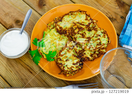 Pancakes from courgettes is tasty vegeterian dish closeup Pancakes from courgettes is tasty vegeterian dish closeup 127219019