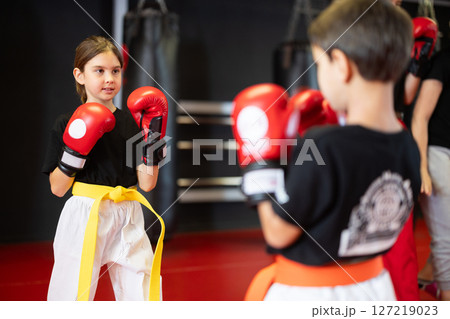 Children in gloves at boxing training 127219023