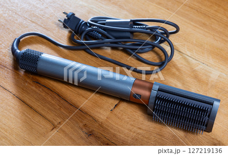 Modern electric hair styler with attachment 127219136