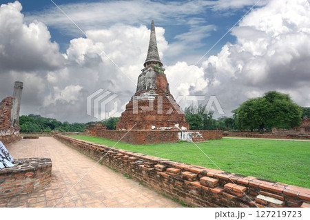 Old pagoda and ruins in Wat Phra Si Sanphet under Dramatic Sky. 127219723