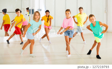 Children studying modern style dances in class indoors 127219793