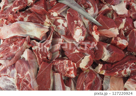 Freshly Sliced, HighQuality Cut Meats Stacked Neatly on a Butchers Wooden Table Top Freshly Sliced, HighQuality Cut Meats Stacked Neatly on a Butchers Wooden Table Top 127220924