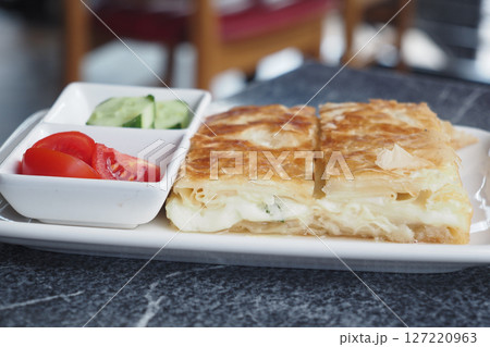 Traditional Turkish Cuisine Pastries borek on a plate Traditional Turkish Cuisine Pastries borek on a plate 127220963