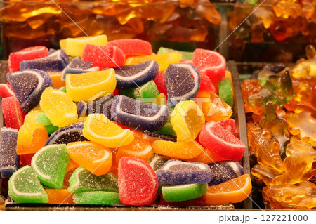 sugar coated jelly beans in the form of colored sliced fruit sugar coated jelly beans in the form of colored sliced fruit 127221000