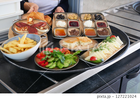 Delicious Mediterranean Spread with Varied Dishes and Salads 127221024