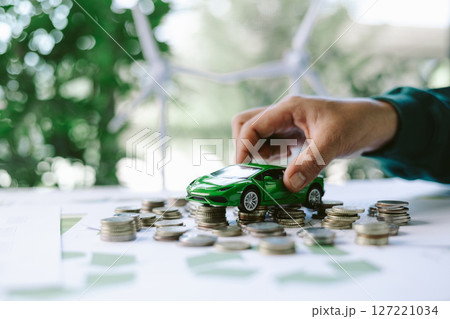 ESG strategies are driving business growth, boosting revenue and financial success by aligning economic goals with sustainable finance. growth, revenue, finance, economic, financial. green car 127221034