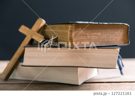 Religious belief concept Close up prayer Christian church service Bible Holy cross Spiritual power Blurred background Desk copy space Heaven God Catholic faith Praise book Jesus worship Gospel symbols Religious belief concept Close up prayer Christian church service Bible Holy cross Spiritual power Blurred background Desk copy space Heaven God Catholic faith Praise book Jesus worship Gospel symbols 127221161