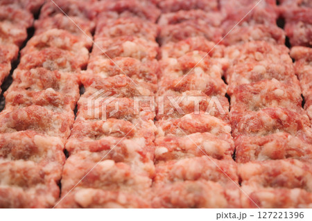 Beautifully Displayed Freshly Prepared Raw Ground Meat Blocks for Sale 127221396