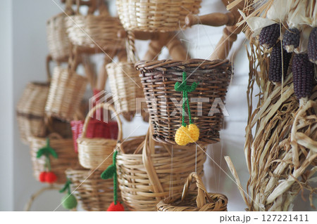 Beautifully Colorful Miniature Woven Baskets Gracefully Displayed on a Wall Beautifully Colorful Miniature Woven Baskets Gracefully Displayed on a Wall 127221411