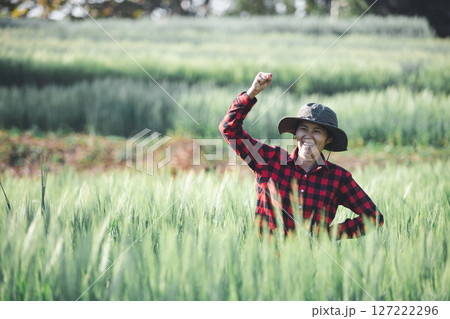 wheat farmer harvest business concept farming agronomist analyzing data barley examines food field summer cereal agriculture Smart farm modern management growth control organic summer background blur wheat farmer harvest business concept farming agronomist analyzing data barley examines food field summer cereal agriculture Smart farm modern management growth control organic summer background blur 127222296
