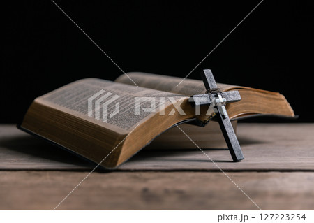 Religious belief concept Close up prayer Christian church service Bible Holy cross Spiritual power Blurred background Desk copy space Heaven God Catholic faith Praise book Jesus worship Gospel symbols Religious belief concept Close up prayer Christian church service Bible Holy cross Spiritual power Blurred background Desk copy space Heaven God Catholic faith Praise book Jesus worship Gospel symbols 127223254
