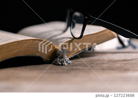 Religious belief concept Close up prayer Christian church service Bible Holy cross Spiritual power Blurred background Desk copy space Heaven God Catholic faith Praise book Jesus worship Gospel symbols Religious belief concept Close up prayer Christian church service Bible Holy cross Spiritual power Blurred background Desk copy space Heaven God Catholic faith Praise book Jesus worship Gospel symbols 127223686