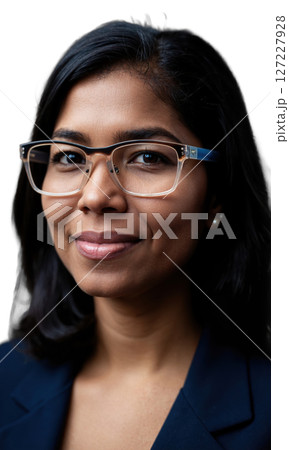 A South Asian female leader with medium-length hair and rectangular glasses, her serene expression illuminated by glowing lines, symbolizing clarity 127227928