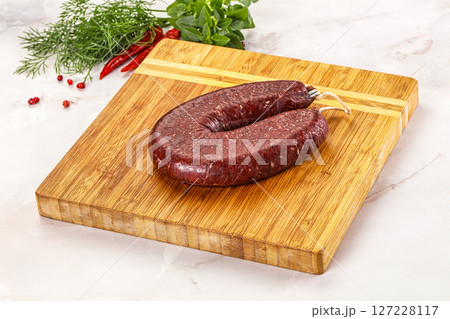 Delicious dry cured beef basturma on table, closeup 127228117