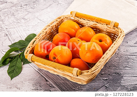 Raw ripe sweet apricots heap 127228123