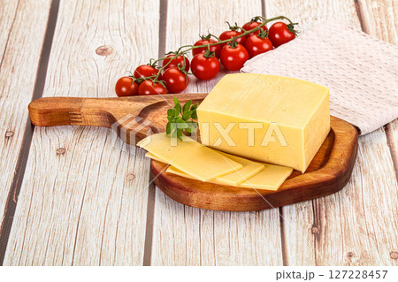 Yellow cheese piece with slices Yellow cheese piece with slices 127228457