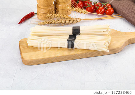 Raw dry white wheat noodles Raw dry white wheat noodles 127228466