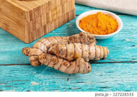 Fresh aroma tumeric roots heap 127228533