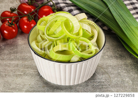 Fresh ripe green leek slices 127229858