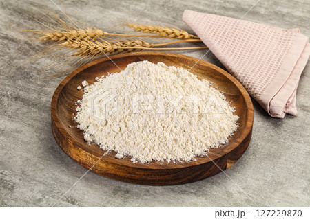 Wheat flour for cooking in the bowl 127229870
