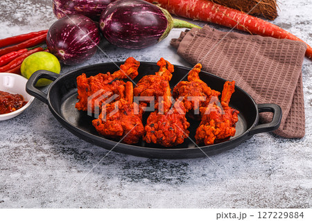 Indian cuisine - spicy Chicken lollipop Indian cuisine - spicy Chicken lollipop 127229884