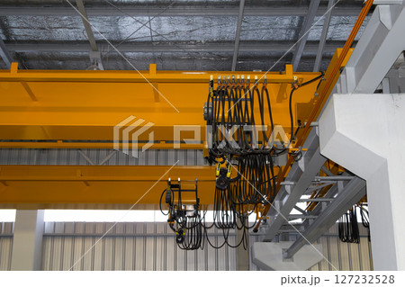 Overhead crane or lifting equipment inside factory or warehouse. Overhead crane or lifting equipment inside factory or warehouse. 127232528