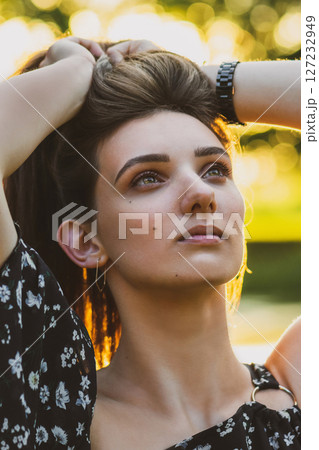 Woman portrait during summer sunset in nature 127232949