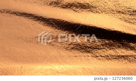 Copper metal plate with a shiny, grunge texture. Weathered, worn surface featuring a rusty, antique Copper metal plate with a shiny, grunge texture. Weathered, worn surface featuring a rusty, antique 127236060