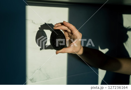 woman hand holding avocado woman hand holding avocado 127236164